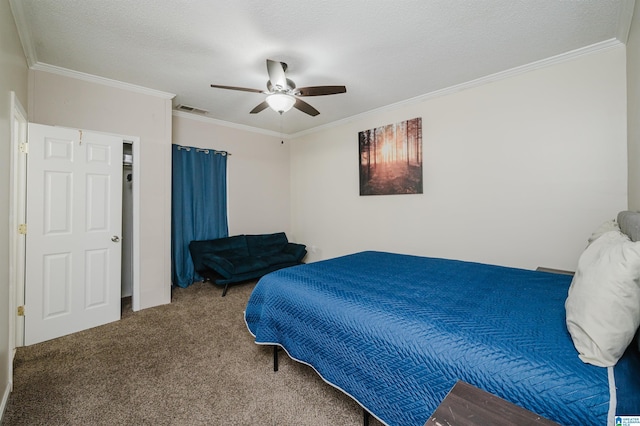 bedroom featuring crown molding, carpet flooring, a textured ceiling, and ceiling fan