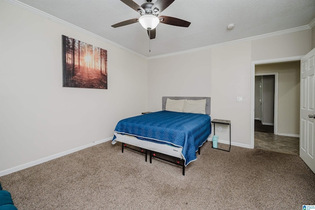 bedroom with ornamental molding, carpet flooring, ceiling fan, and a textured ceiling