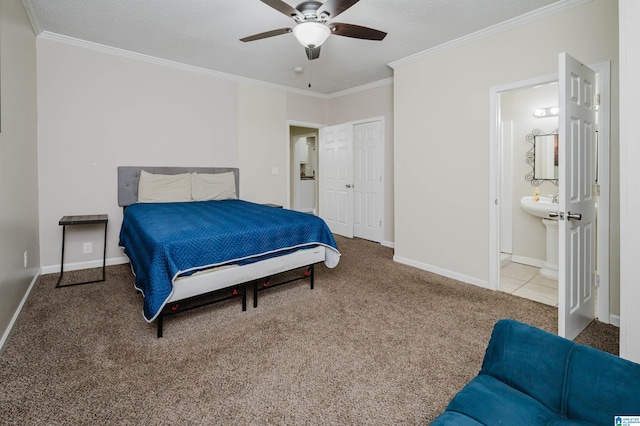 bedroom with crown molding, carpet flooring, connected bathroom, and ceiling fan