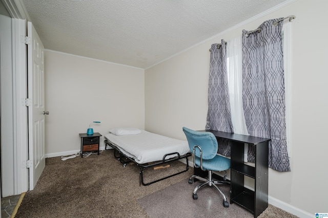 bedroom with crown molding, carpet flooring, and a textured ceiling