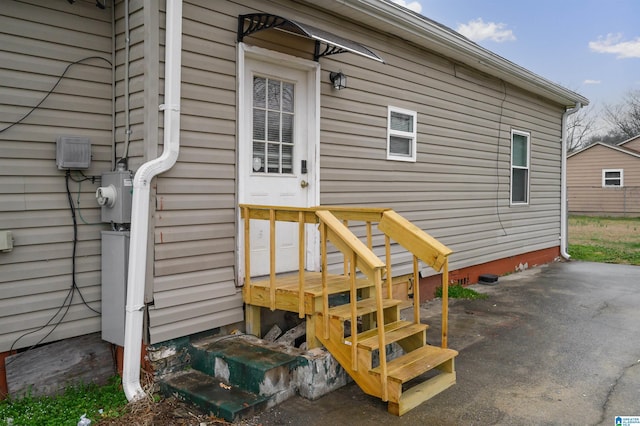 entrance to property featuring a patio area