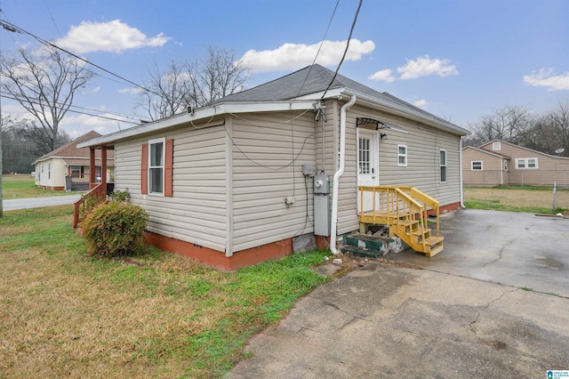 view of home's exterior with a yard