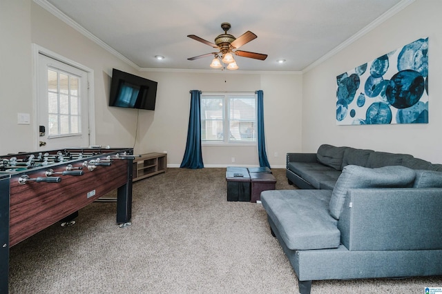 playroom featuring a wealth of natural light, ornamental molding, ceiling fan, and carpet flooring