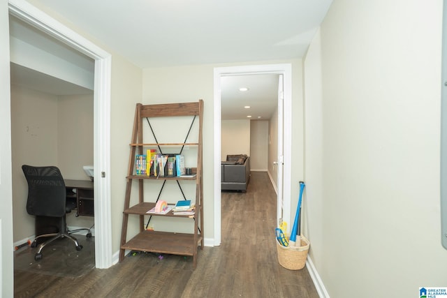 corridor featuring dark hardwood / wood-style flooring