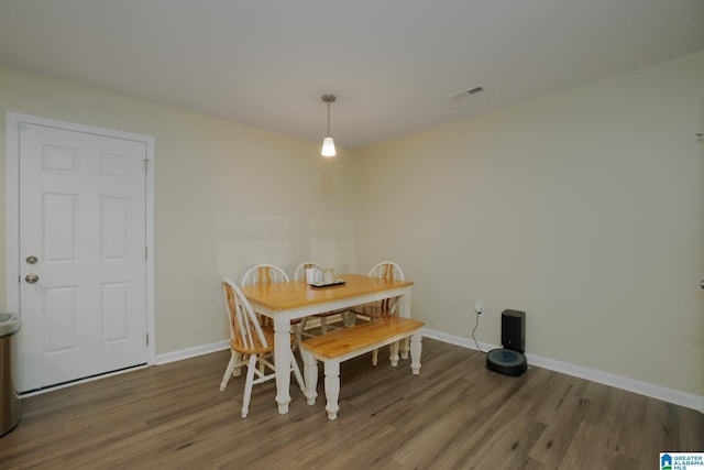 dining room with hardwood / wood-style flooring