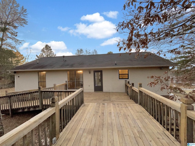 rear view of house featuring a deck