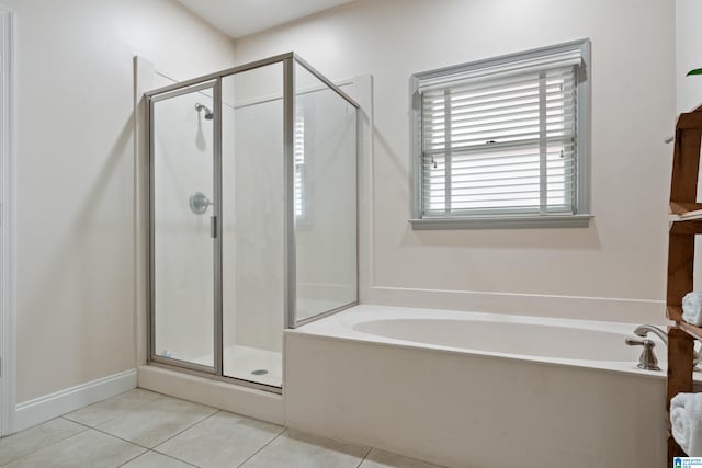 bathroom with tile patterned floors and plus walk in shower