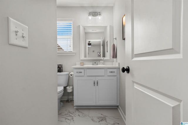 bathroom featuring vanity and toilet