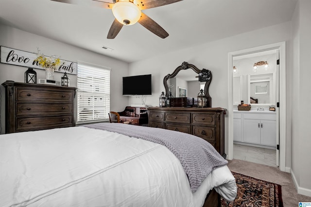 bedroom featuring connected bathroom and ceiling fan