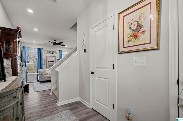 hall with light hardwood / wood-style flooring