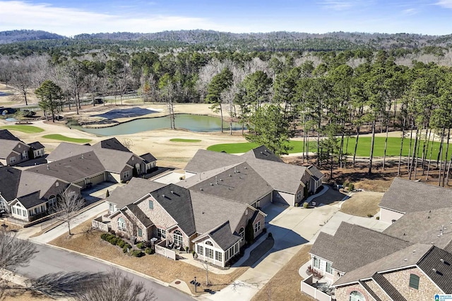 drone / aerial view with a water view and a residential view