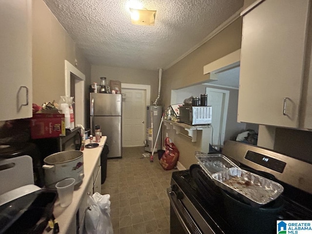 kitchen with gas water heater, stainless steel refrigerator, and a textured ceiling