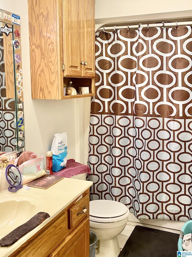 bathroom featuring toilet and tile patterned flooring