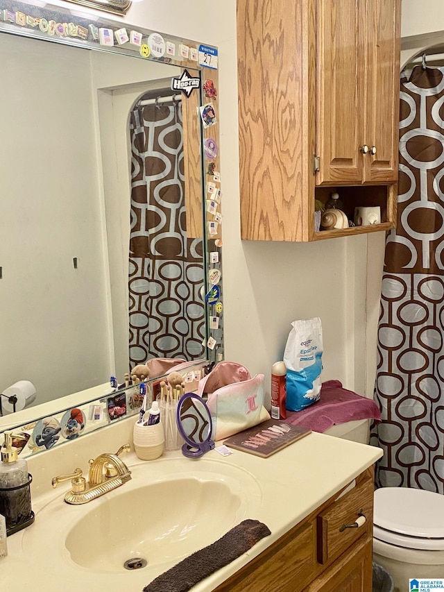 bathroom with vanity and toilet