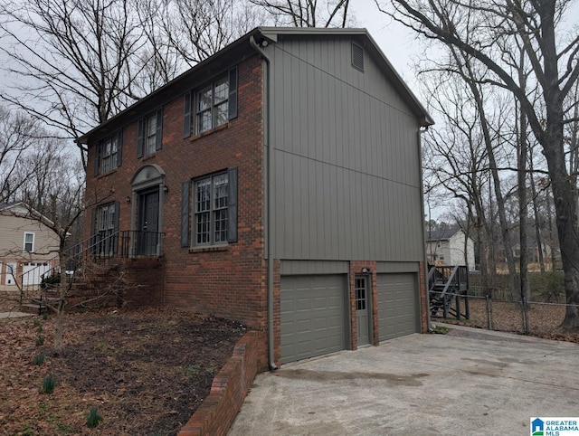 view of side of home featuring a garage