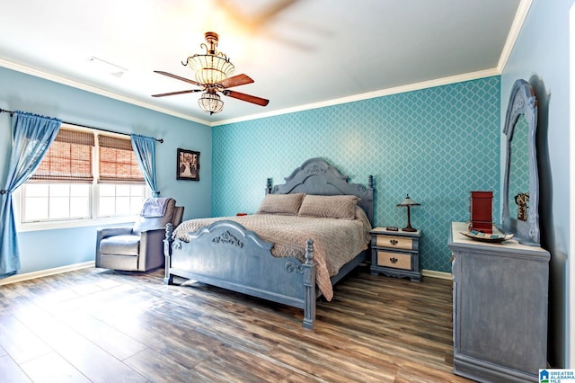 bedroom with crown molding, dark hardwood / wood-style floors, and ceiling fan