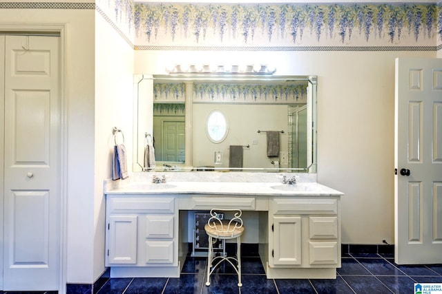 bathroom with tile patterned flooring, vanity, and an enclosed shower