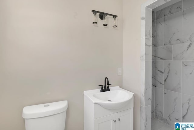 bathroom with toilet and vanity