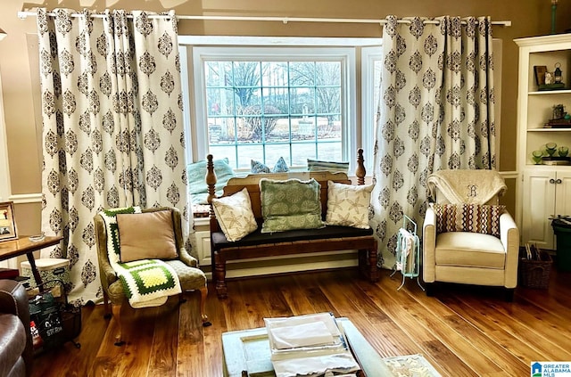 living area with hardwood / wood-style flooring