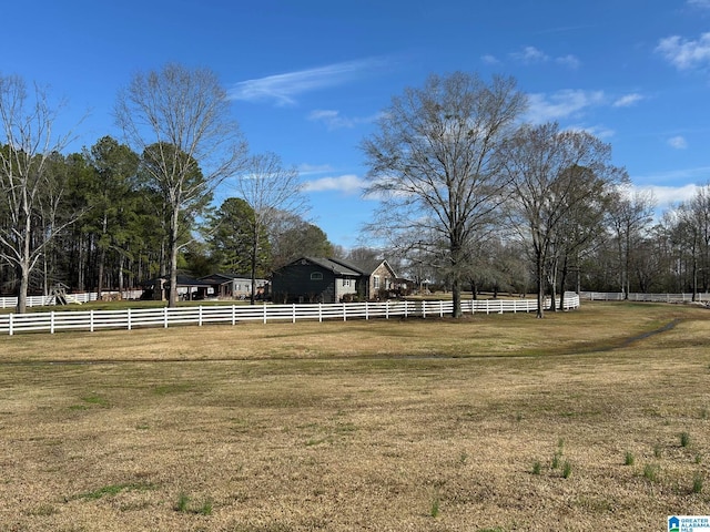 view of yard with a rural view