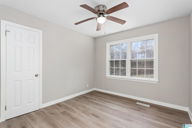 unfurnished room with ceiling fan and light hardwood / wood-style flooring