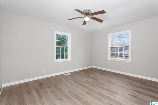 unfurnished room featuring ceiling fan and light wood-type flooring