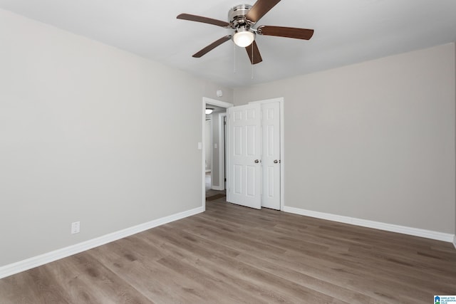 unfurnished bedroom with hardwood / wood-style flooring and ceiling fan