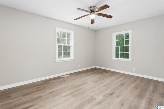 spare room featuring ceiling fan and light wood-type flooring