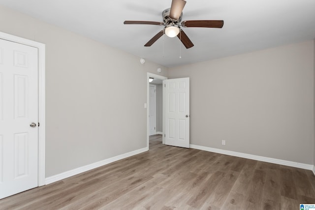 unfurnished bedroom with light hardwood / wood-style flooring and ceiling fan