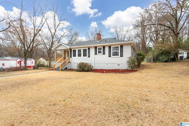 view of front of home with a porch and a front yard