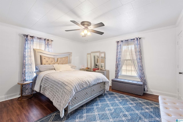 bedroom with crown molding, ceiling fan, and dark hardwood / wood-style flooring