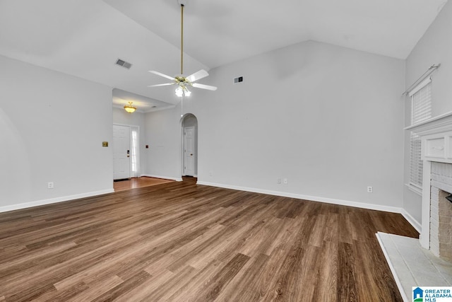 unfurnished living room featuring a fireplace, ceiling fan, high vaulted ceiling, and hardwood / wood-style flooring