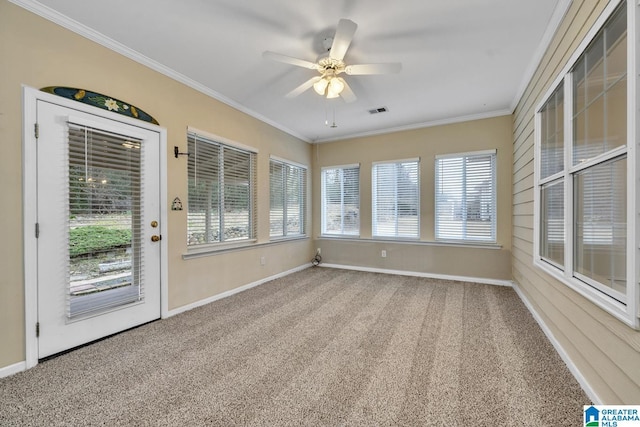 unfurnished sunroom with ceiling fan