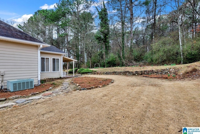 view of yard with central AC