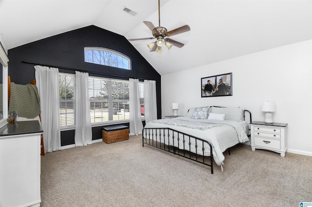 bedroom with baseboards, visible vents, a ceiling fan, light colored carpet, and high vaulted ceiling