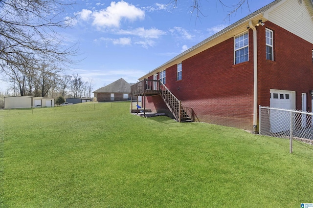 view of yard featuring stairs and fence