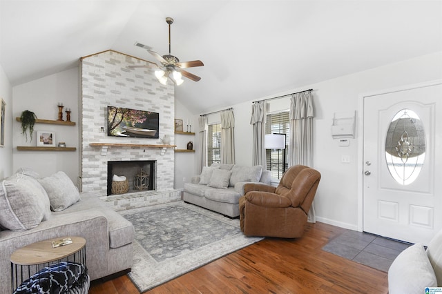 living room with lofted ceiling, dark wood-style floors, a brick fireplace, and visible vents