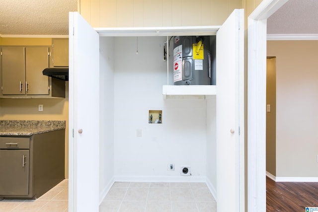 laundry room with washer hookup, a textured ceiling, water heater, and electric dryer hookup