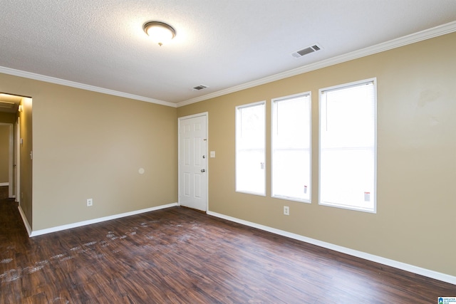 unfurnished room with ornamental molding, dark hardwood / wood-style floors, and a textured ceiling