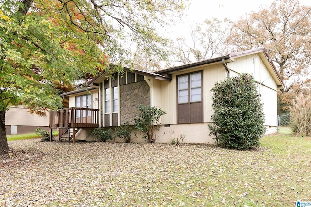 view of property exterior with a deck