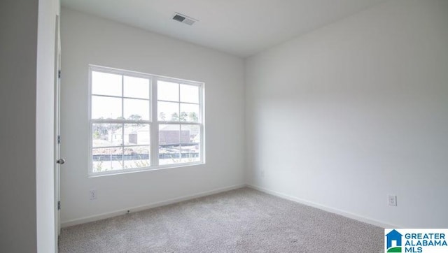 empty room featuring carpet flooring