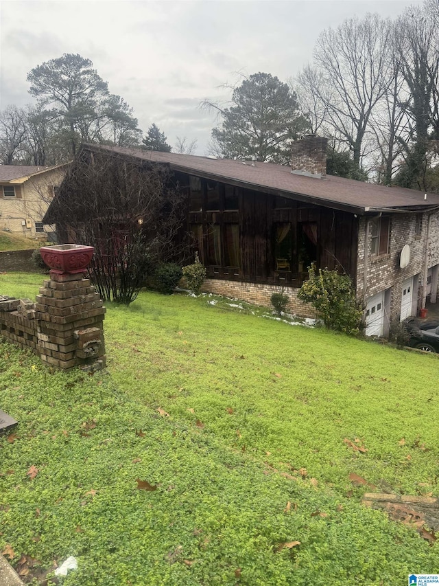 view of yard featuring a garage