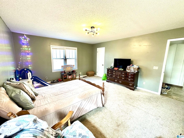 carpeted bedroom with a textured ceiling