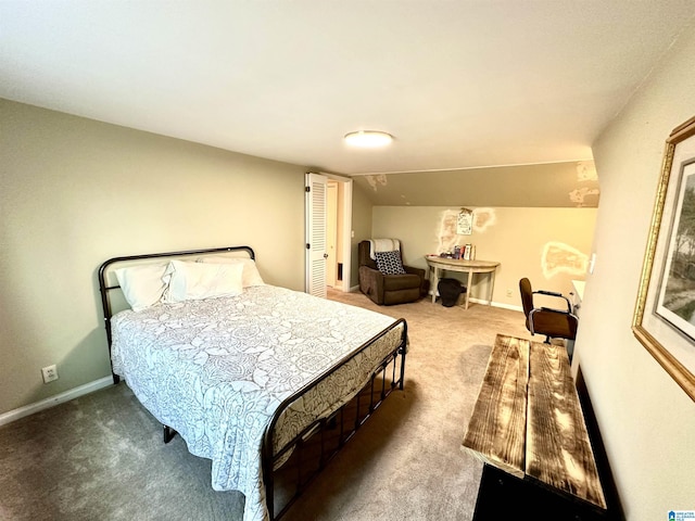 carpeted bedroom with lofted ceiling