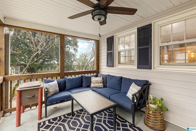 sunroom featuring ceiling fan