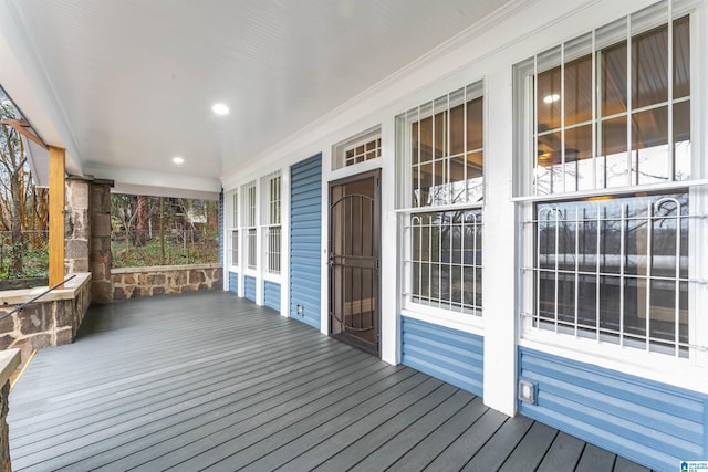 wooden terrace with a porch