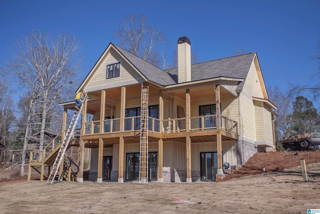 back of property featuring a balcony