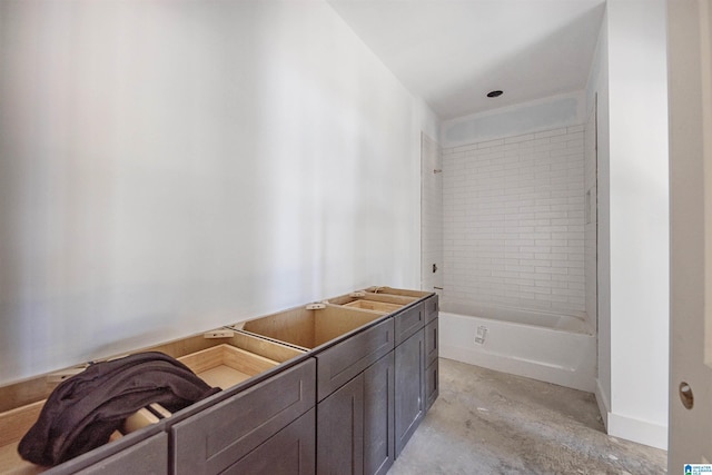 bathroom with concrete flooring