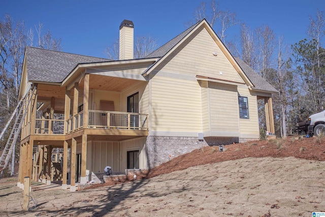 rear view of house with a balcony