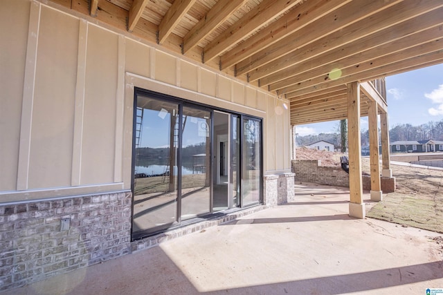 view of patio with a water view